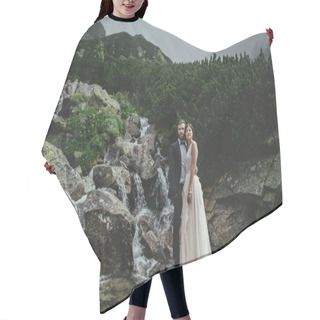 Personality  Newlyweds Hugging Near Cold Waterfall  Hair Cutting Cape