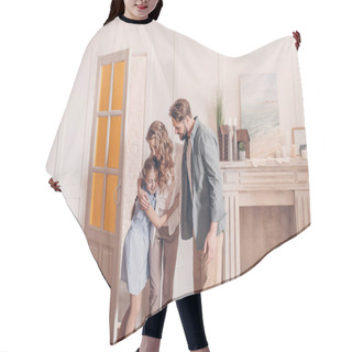 Personality  Happy Family Embracing And Standing At Home With Fireplace Behind Hair Cutting Cape