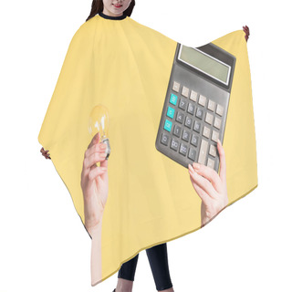 Personality  Cropped View Of Woman Holding Led Lamp And Calculator In Hands Isolated On Yellow, Energy Efficiency Concept  Hair Cutting Cape