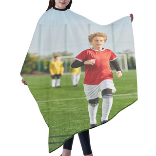 Personality  A Young Boy Is Joyfully Sprinting Across A Lush Green Soccer Field, With The Focus On His Agile Movement And Enthusiasm For The Game. Hair Cutting Cape