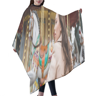 Personality  Side View Of Curly Young Woman In Beige Trench Coat Standing Near Carousel In Amusement Park, Banner Hair Cutting Cape