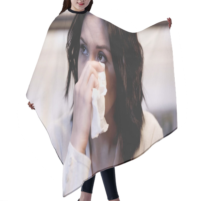 Personality  crying brunette woman wiping tears with paper napkin at home hair cutting cape