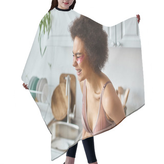 Personality  Portrait Of Happy African American Woman In Bra With Pink Patches Under Eyes Laughing In Kitchen Hair Cutting Cape