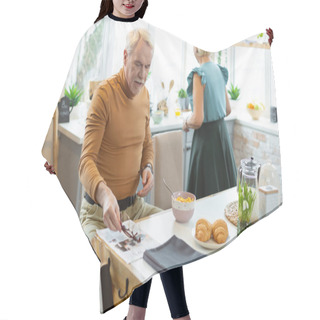 Personality  Attractive Man Sitting While His Spouse Cooking At The Kitchen Hair Cutting Cape