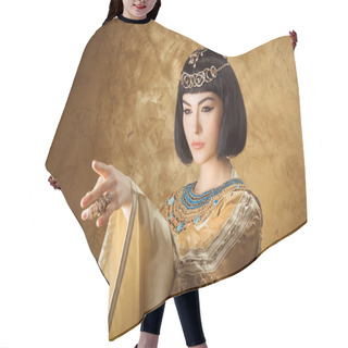 Personality  Beautiful Egyptian Woman Like Cleopatra Pointing Finger Away On Golden Background Hair Cutting Cape