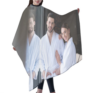 Personality  Happy Young Couple In Bathrobes Smiling At Camera In Spa Center Hair Cutting Cape