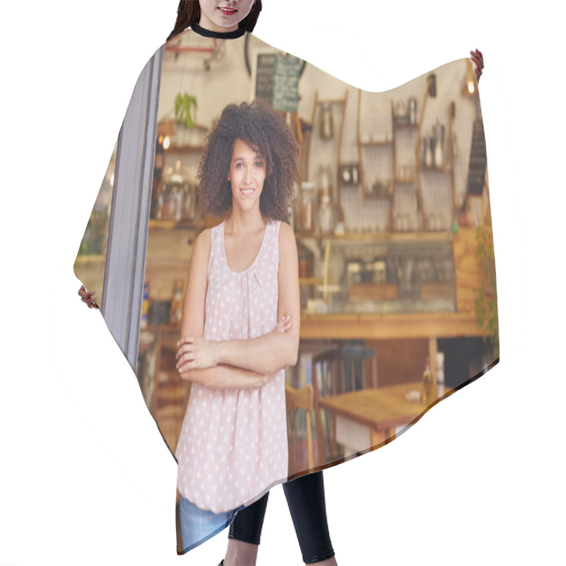 Personality  Small business owner standing in door hair cutting cape