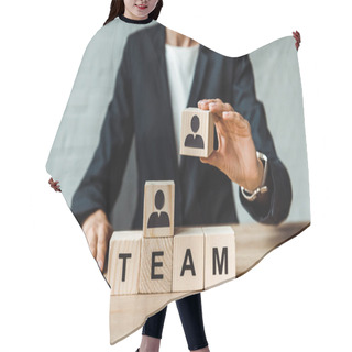 Personality  Cropped View Of Businesswoman Holding Wooden Cube With Human Shape  Hair Cutting Cape