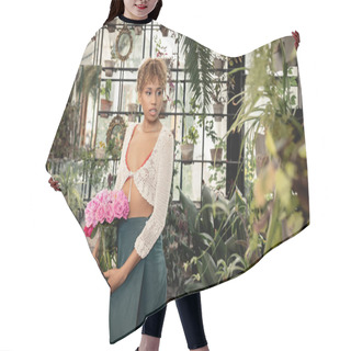 Personality  Young Stylish African American Woman In Summer Outfit Holding Vase With Pink Flowers Standing Near Green Plants In Modern Orangery At Background, Trendy Woman With Tropical Flair, Summer Concept Hair Cutting Cape