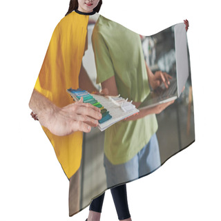Personality  Cropped View Of Young Craftsman Holding Cloth Swatches While Working With Blurred African American Colleague Using Laptop And Standing In Print Studio, Small Business Concept Hair Cutting Cape