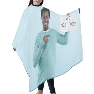 Personality  Pleased African American Man Pointing With Finger At Speech Bubble With We Need You Lettering Isolated On Blue Hair Cutting Cape