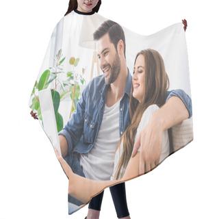 Personality  Laughing Young Couple Sitting On Couch With Digital Tablet At Home  Hair Cutting Cape