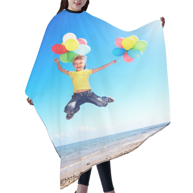 Personality  Child playing with balloons at the beach hair cutting cape