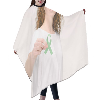 Personality  Cropped Shot Of Woman Showing Green Awareness Ribbon For Adrenal Cancer, Aging Research Awareness, BiPolar Disorder Isolated On White Hair Cutting Cape