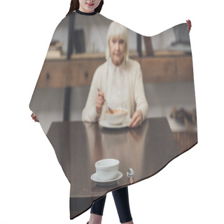 Personality  Selective Focus Of Bowl And Spoon On Table With Senior Woman Eating On Background Hair Cutting Cape