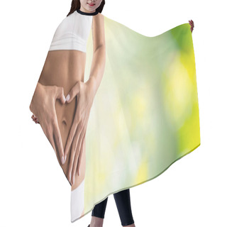 Personality  Middle Part Of Female Body With Heart Shape From Hands. A Woman In Underwear Symbolizes A Healthy Lifestyle, A Healthy Stomach, Menstruation Or Pregnancy. Green Natural Background. Hair Cutting Cape