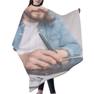 Personality  Selective Focus Of Animator Using Digital Tablet Near Paper With Sketches  Hair Cutting Cape