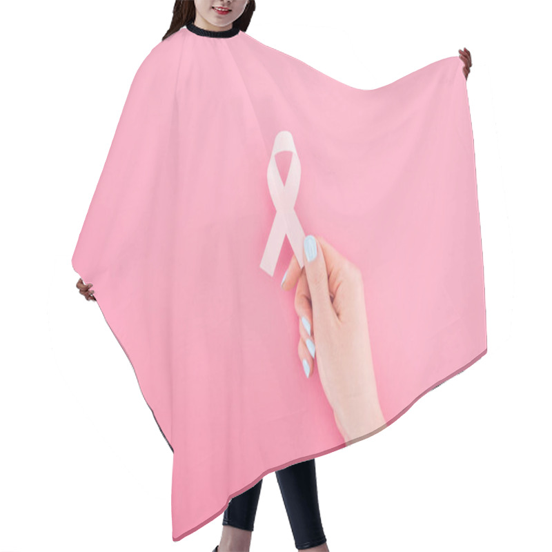 Personality  partial view of woman with pink breast cancer sign on pink background hair cutting cape