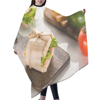 Personality  Selective Focus Of Fresh Green Sandwich On Wooden Cutting Board Near Tomato And Avocado On White Marble Surface Hair Cutting Cape