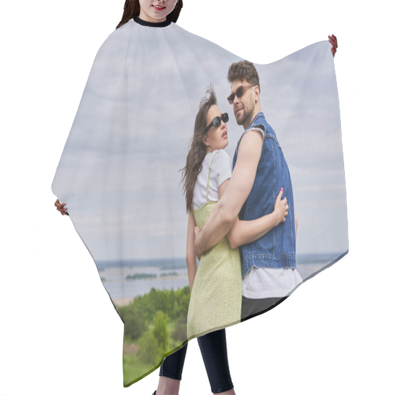 Personality  Fashionable Romantic Couple In Sunglasses And Summer Outfits Embracing And Standing With Blurred Rural Landscape And Cloudy Sky At Background, Countryside Leisurely Stroll, Tranquility Hair Cutting Cape