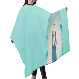 Personality  Scared Redhead Preteen Kid In T-shirt Looking At Camera While Posing Around Blue Torn Paper Hole On White Background, Child Protection Day Concept, Banner  Hair Cutting Cape