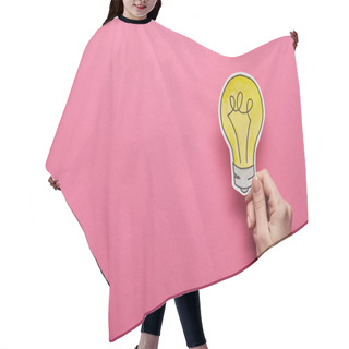Personality  Top View Of Hand Holding Yellow Light Bulb On Pink Background Hair Cutting Cape