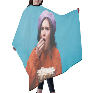 Personality  Worried Woman In Lilac Beret Eating Popcorn While Watching Movie Isolated On Blue Hair Cutting Cape