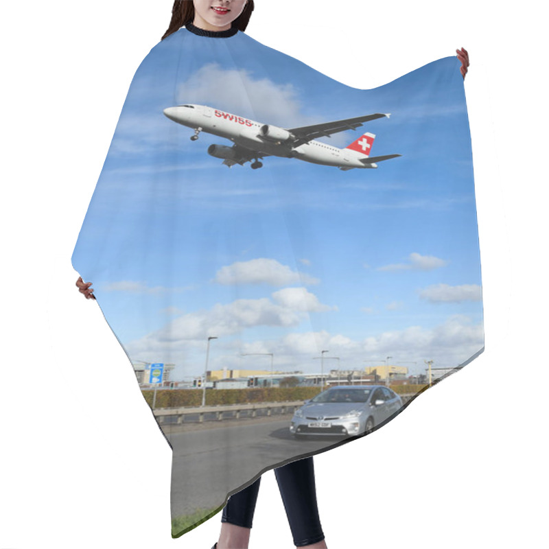 Personality  LONDON, ENGLAND - NOVEMBER 2018: Swiss Airliner Coming Into Land At London Heathrow Airport Passing Over Traffic On The A30 Dual Carriageway. Hair Cutting Cape