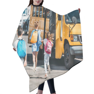 Personality  Rear View Of Group Of Schoolchildren Running To School Bus Hair Cutting Cape
