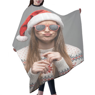 Personality  Beautiful Skeptical Woman In Christmas Sweater, Santa Hat And Sunglasses, Isolated On Grey Hair Cutting Cape
