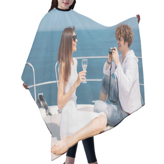 Personality  Attractive Couple On The Yacht. Young Man Is Taking Photo Of His Girlfriend Hair Cutting Cape