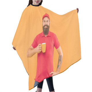Personality  Happy Bearded Man In Casual Red Cap And Tshirt Holding Mug Yellow Background, Tea. Hair Cutting Cape