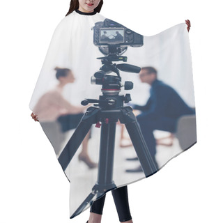Personality  Side View Of Businessman Giving Interview To Journalist In Office, Camera On Tripod On Foreground Hair Cutting Cape