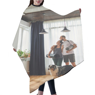 Personality  Smiling Man In Sportswear Hugging Girlfriend And Holding Fitness Mat Near Border Collie At Home Hair Cutting Cape