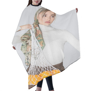 Personality  Woman In Stylish Kerchief Posing With Fresh Oranges In Mesh Bag Isolated On Grey Hair Cutting Cape