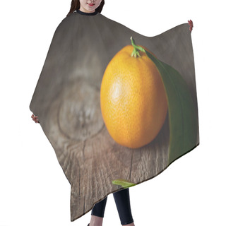 Personality  Selective Focus Of Organic Tasty Tangerine On Wooden Table  Hair Cutting Cape