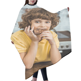 Personality  Cute Little Boy Eating Chocolate With Hazelnuts And Looking At Camera  Hair Cutting Cape