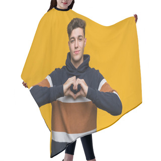 Personality  Young Cool Man Wearing A Hoodie Smiling And Showing A Heart Shape With Him Hands. Hair Cutting Cape