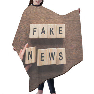 Personality  Cropped Image Of Journalist Taking Wooden Cubes With Words Fake News At Wooden Table Hair Cutting Cape