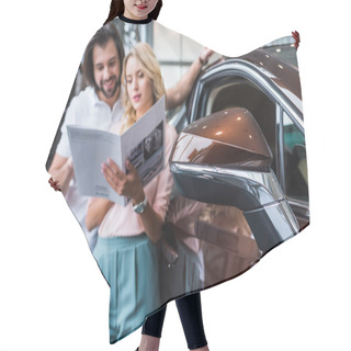 Personality  Selective Focus Of Couple With Catalog Choosing Car At Dealership Salon Hair Cutting Cape