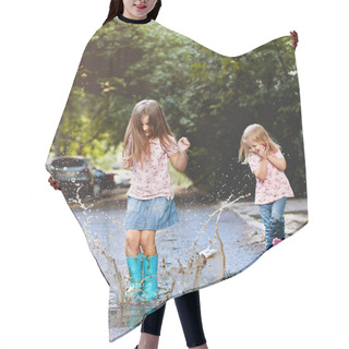 Personality  Full Body Little Girl In Rain Boots Jumping Into Puddle Of Water Near Laughing Sister While Playing On Street Together Hair Cutting Cape