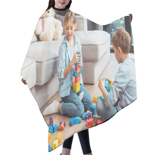 Personality  Cute Siblings Playing With Building Blocks While Sitting On Floor In Living Room  Hair Cutting Cape