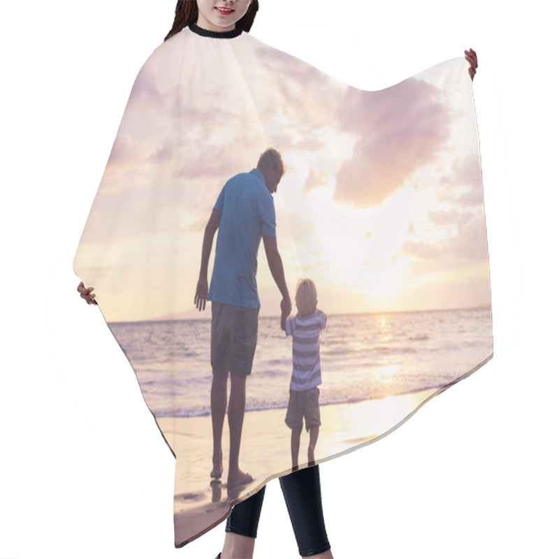 Personality  Father and son wallking on the beach hair cutting cape