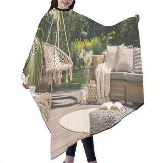 Personality  Pouf On Wooden Terrace With Rattan Sofa And Table In The Garden With Hanging Chair. Real Photo Hair Cutting Cape