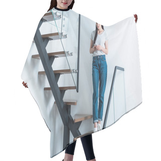 Personality  Woman Using Smartphone While Standing On Stairs At Home Hair Cutting Cape