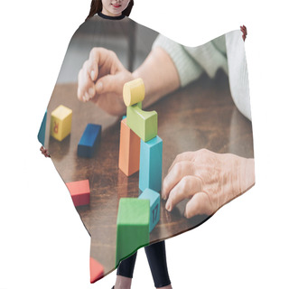 Personality  Cropped View Of Senior Woman Playing With Wooden Toys On Table Hair Cutting Cape