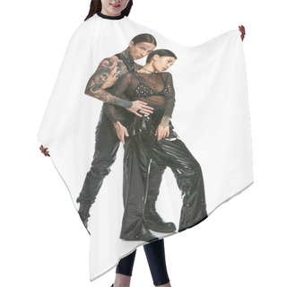 Personality  A Stylish And Tattooed Man And Woman Dressed In Black Posing Together In A Studio On A Grey Background. Hair Cutting Cape