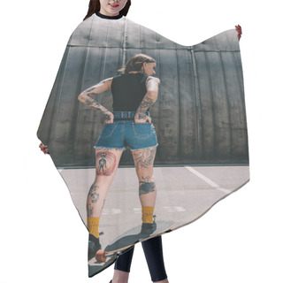 Personality  Rear View Of Stylish Tattooed Girl With Hands In Pockets Skateboarding At Parking Lot  Hair Cutting Cape