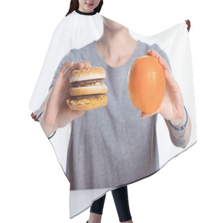 Personality  Cropped Shot Of Girl Holding Hamburger And Ripe Orange Hair Cutting Cape