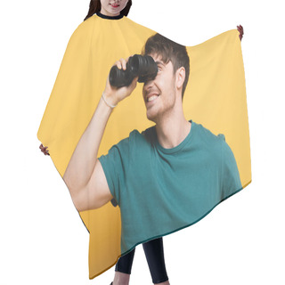 Personality  Handsome Smiling Man Looking Through Binoculars On Yellow Hair Cutting Cape